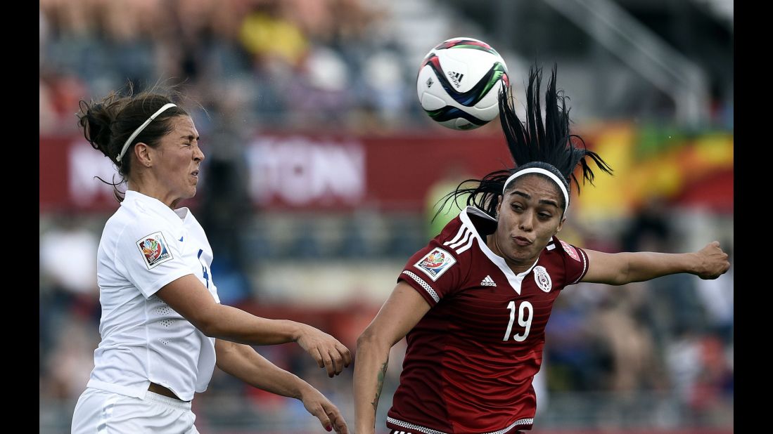 Mexican forward Renae Cuellar, right, competes with English midfielder Fara Williams.