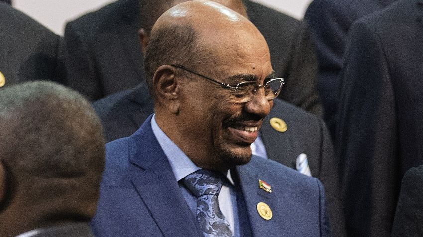 Sudanese President Omar al-Bashir, left, is all smiles as he greets Zimabwean President Robert Mugabe on Sunday.