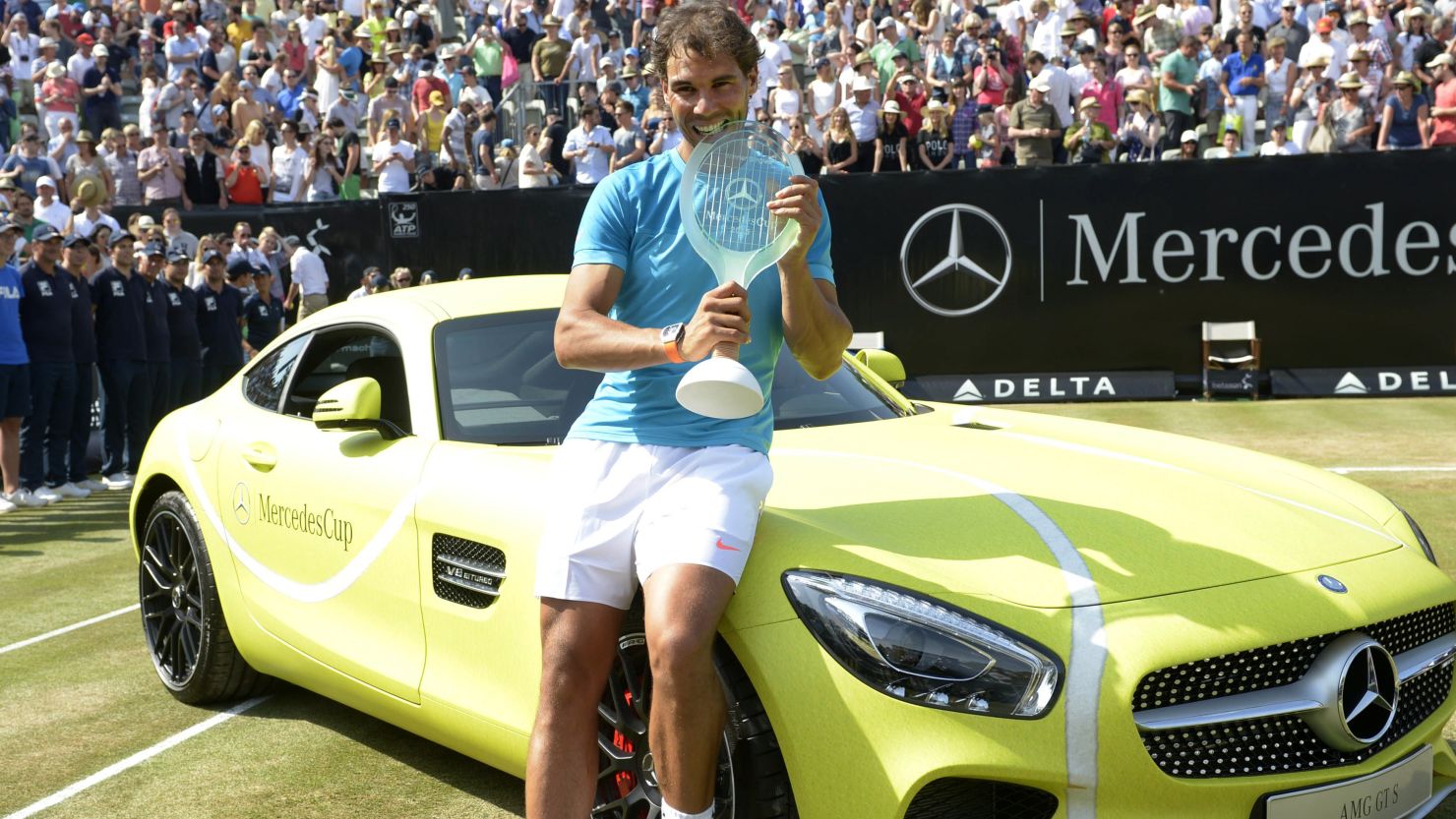Rafael Nadal poses with his prizes after winning the ATP Tour tournament in Stuttgart, Germany. 