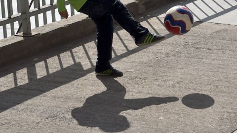 Kid playing soccer