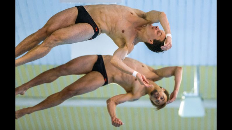Germany's Patrick Hausding, front, and Sascha Klein perform a synchronized platform dive Sunday, June 14, at the European Diving Championships in Rostock, Germany. They won the event.