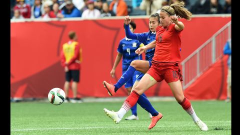 Germany midfielder Melanie Leupolz, right, and Thailand midfielder Silawan Intamee vie for the ball during a match June 15 in Winnipeg. Germany won 4-0. 