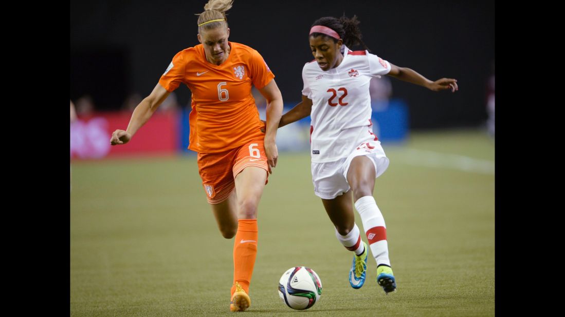 The Netherlands' Anouk Dekker, left, and Canada's Ashley Lawrence chase the ball during the first half of a match June 15 in Montreal. The two teams tied 1-1.