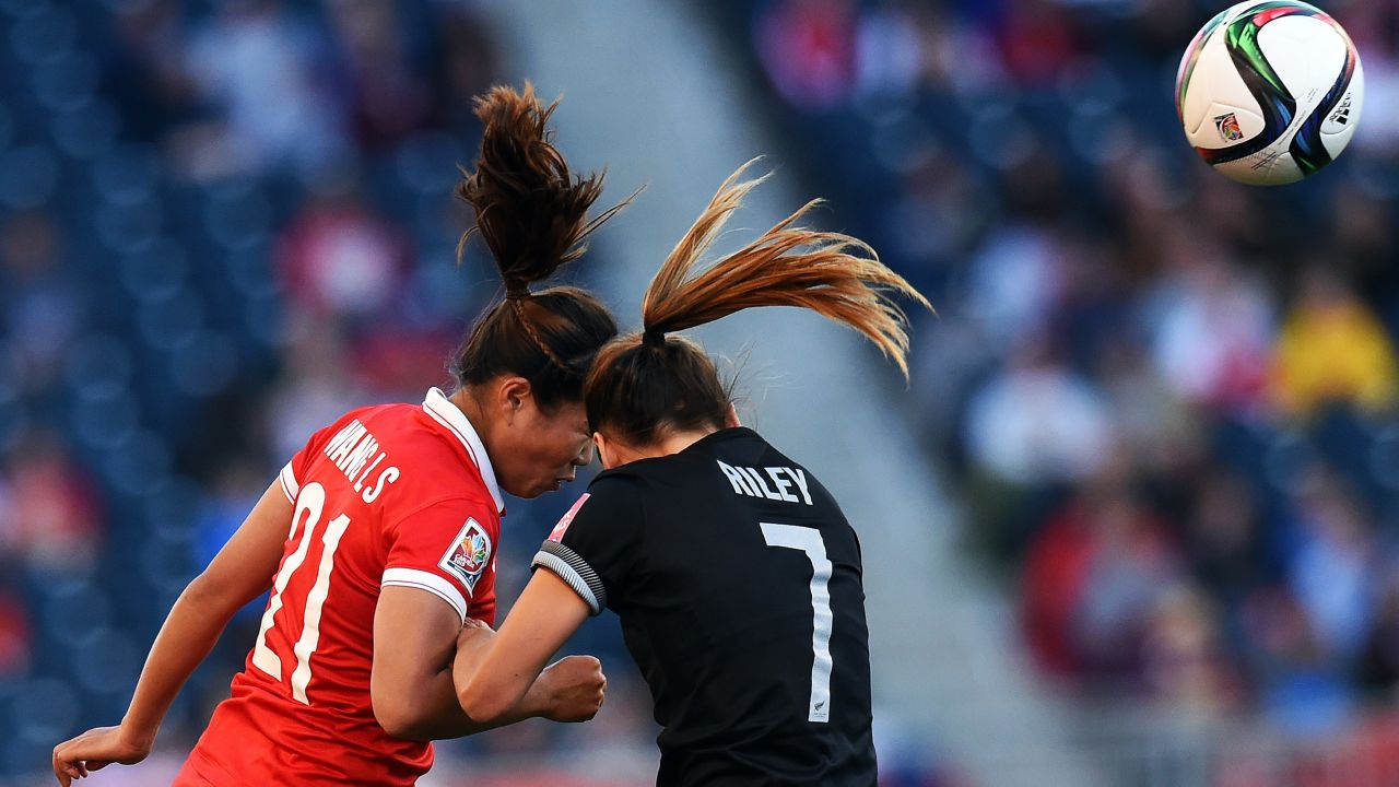 China midfielder Wang Lisi, left, and New Zealand defender Ali Riley vie for the ball. 
