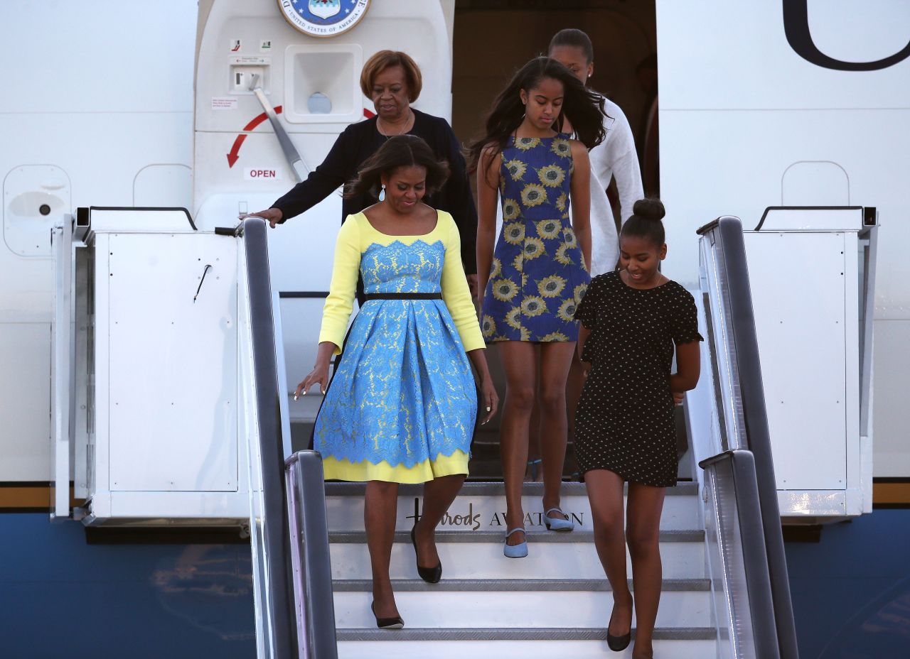 First lady Michelle Obama arrives in London with her daughters -- Sasha, right, and Malia -- and her mother, Marian Robinson, on Monday, June 15. The first lady is in Europe as part of a global tour promoting her Let Girls Learn Initiative.