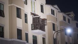 A fourth floor balcony rests on the balcony below after collapsing at the Library Gardens apartment complex in Berkeley, Calif., early Tuesday, June 16, 2015. Berkeley police say several people are dead and others injured after the balcony fell shortly before 1 a.m., near the University of California, Berkeley. (AP Photo/Noah Berger)