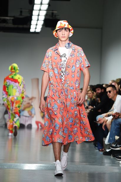 Known for quirky prints and motifs, Kit Neale threw every color imaginable onto the runway across bomber jackets, boiler suits, shorts, parachute pants and this floral print smock dress. For men. 