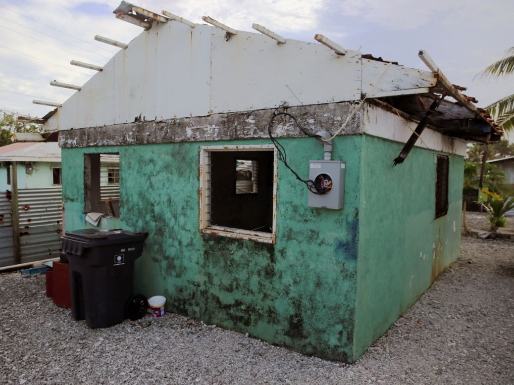 Angie Hepisus and her family said they decided not to repair this house after it was damaged in floods. Land in the Marshall Islands is managed communally by chiefs, so families often live in clusters together. 