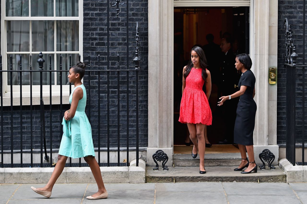 Sasha Obama, left, and Malia Obama, center, leave Downing Street after a meeting with the Prime Minister and his wife on June 16.