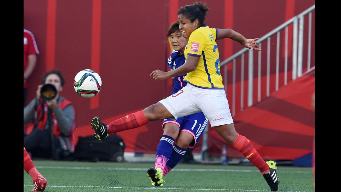 Japan forward Shinobu Ohno and Ecuador forward Denise Pesantes compete for the ball. 
