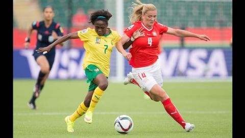 Cameroon's Gabrielle Onguene, left, and Switzerland's Rachel Rinast compete for the ball during a Women's World Cup match in Edmonton on June 16. Cameroon won the match 2-1.