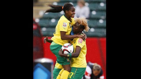 Cameroon's Aurelle Awona, left, celebrates with teammate Gaelle Enganamouit.