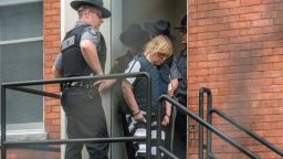 Photos of Joyce Mitchell leaving courthouse