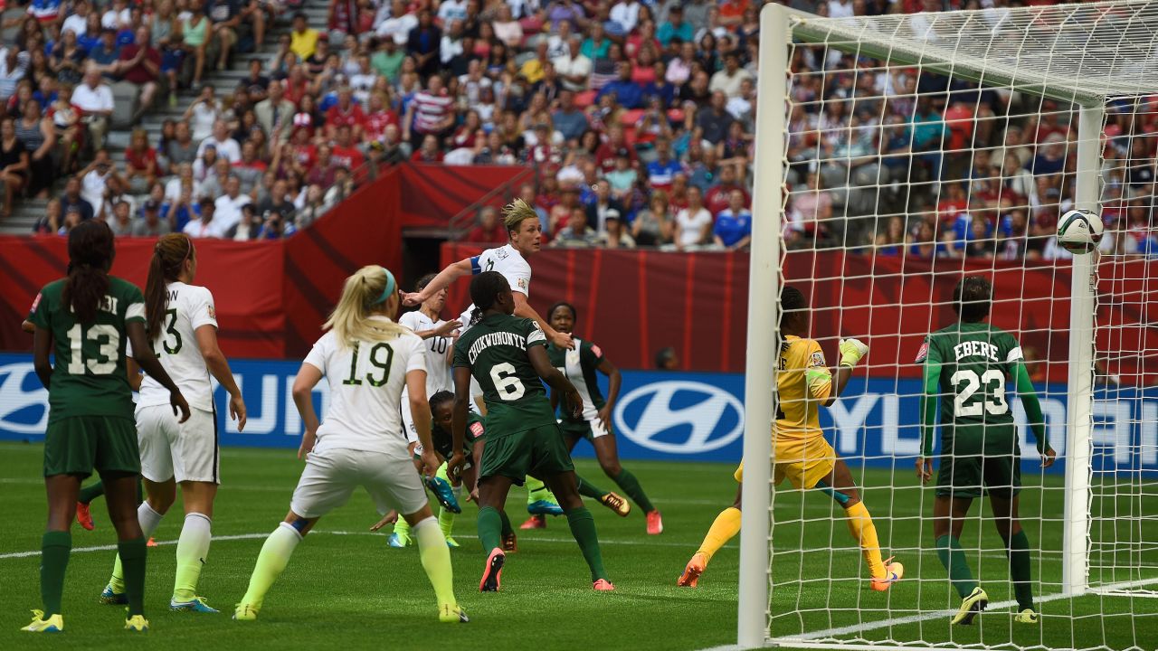 Wambach, top, scores against Nigeria during a match Tuesday, June 16, in Vancouver, British Columbia. The Americans won the match 1-0, clinching top spot in their group.