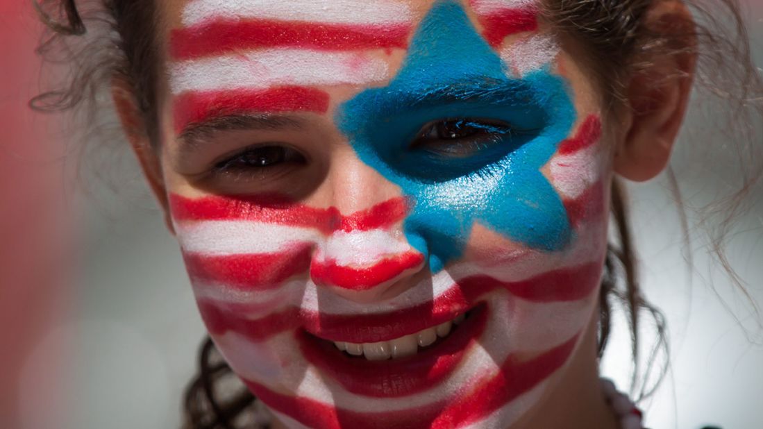 A young U.S. fan watches the team warm up in Vancouver.