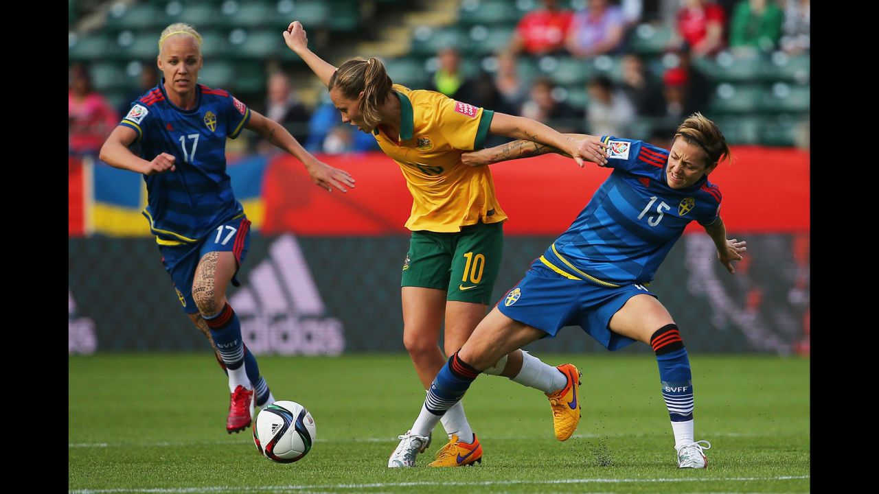 Sweden's Therese Sjogran, right, and Australia's Emily Van Egmond battle for control of the ball during a match in Edmonton on Tuesday, June 16. The match ended in a 1-1 draw.