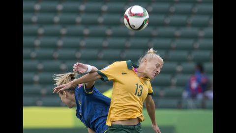 Australia's Tameka Butt, right, and Sweden's Lisa Dahlkvist compete in the second half.
