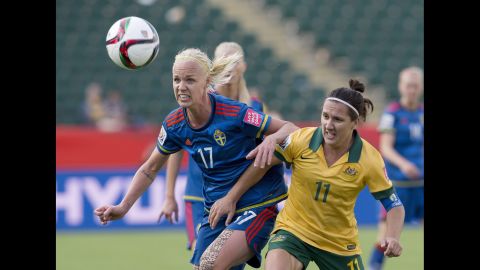 Australia's Lisa De Vanna, right, and Sweden's Caroline Seger watch the ball.