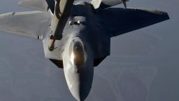IN FLIGHT - SEPTEMBER 23: In this handout image provided by the U.S. Air Force, A KC-10 Extender refuels an F-22 Raptor fighter aircraft prior to strike operations in Syria, during flight on September 23, 2014. These aircraft were part of a strike package that was engaging ISIL targets in Syria. (Photo by Maj. Jefferson S. Heiland/U.S. Air Force via Getty Images)