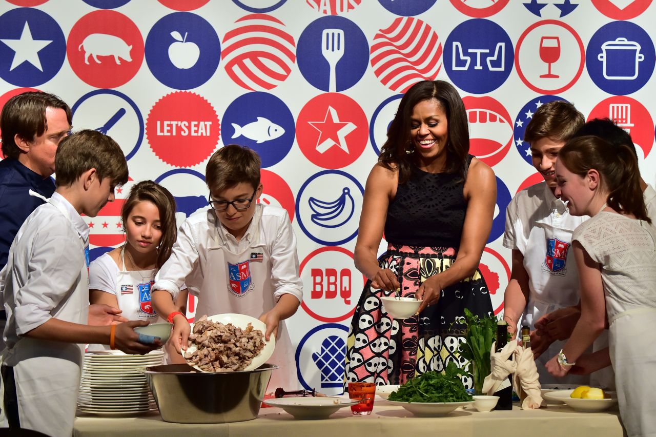 Michelle Obama cooks with children from the American School of Milan on June 17.