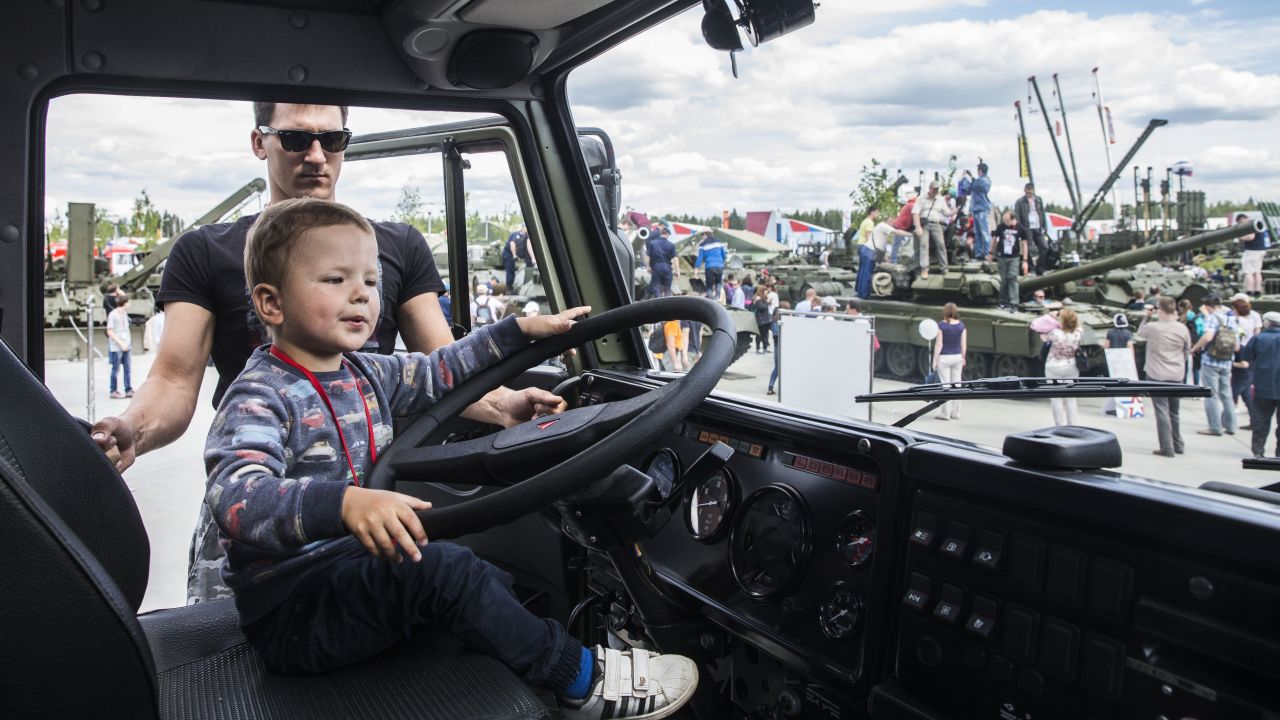  A child climbs inside a Russian army truck.