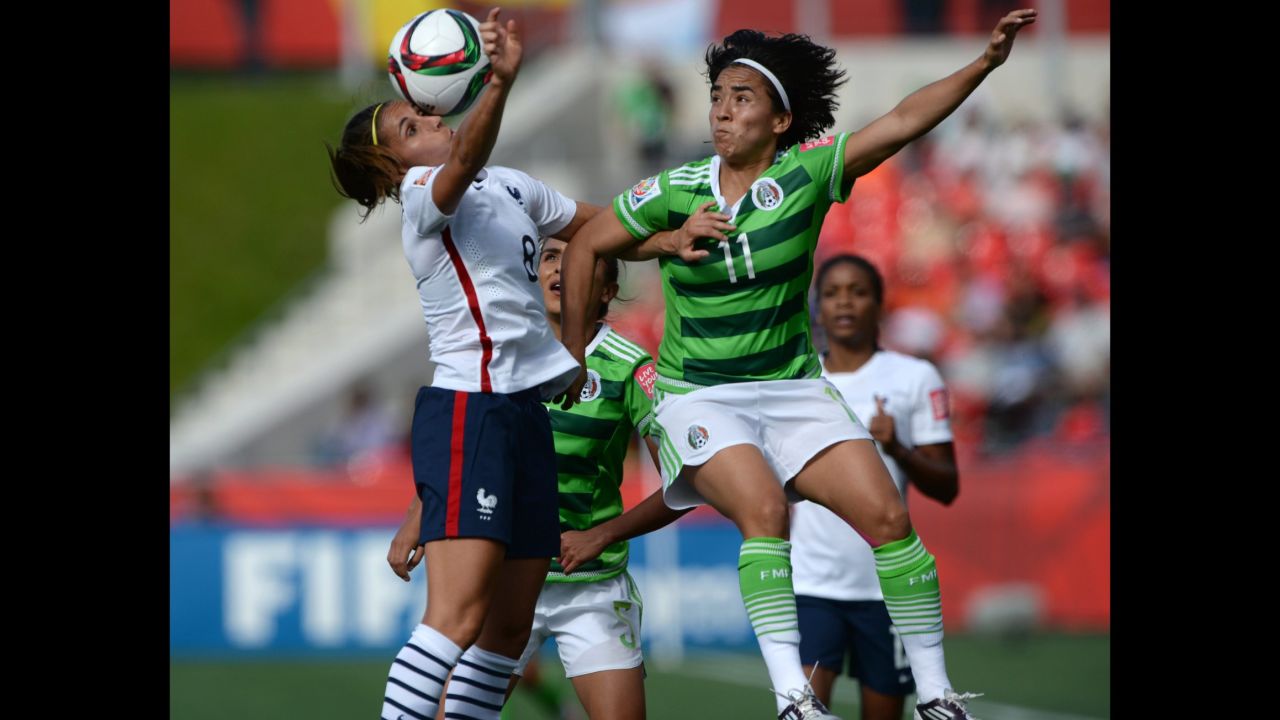 Mexico's Monica Ocampo, right, and France's Jessica Houara battle for the ball. 