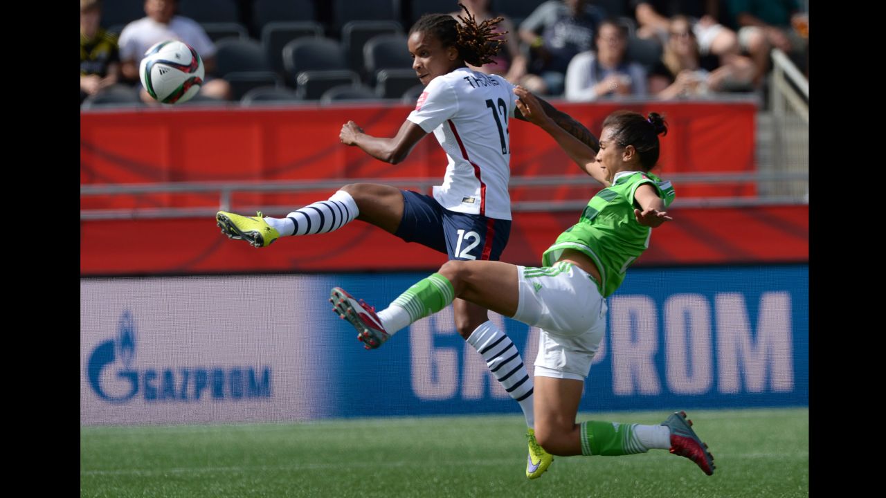 France's Elodie Thomis, left, drives the ball past a Mexico defender. 