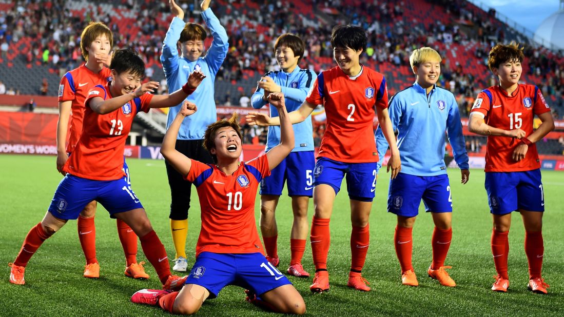 South Korean players celebrate after they defeated Spain 2-1 in Ottawa on Wednesday, June 17.