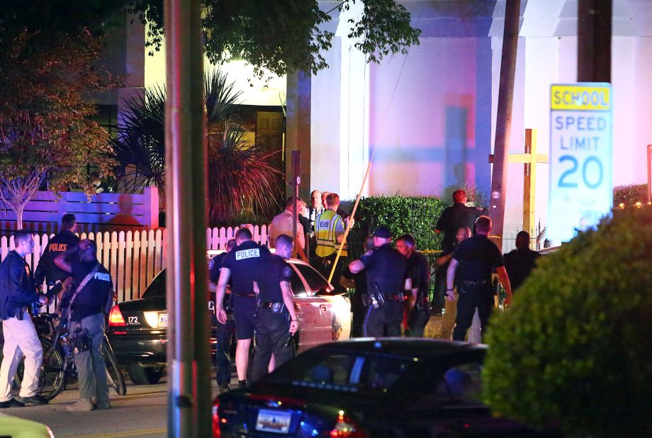 Police gather at the scene of the shooting on June 17. The church was formed in 1816.