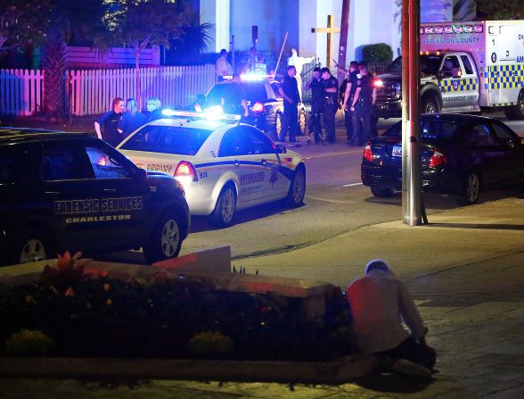 Police stand outside the church.