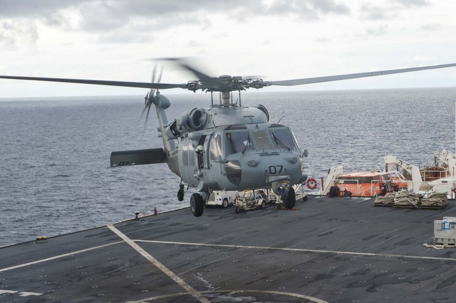 The floating hospital is equipped with an MH-60S Sea Hawk helicopter, pictured taking off from the flight deck.