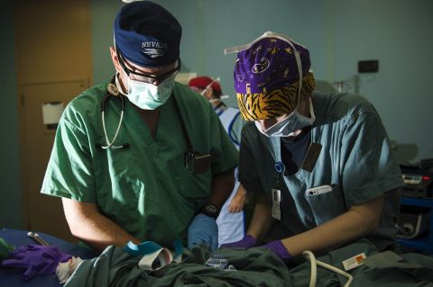 An anesthetist and a peri-operative nurse prepare a Guatemalan child for surgery on board the ship.