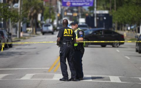 Law enforcement officers in Charleston, South Carolina, stand guard near the scene of the shooting at Emanuel African Methodist Episcopal Church.