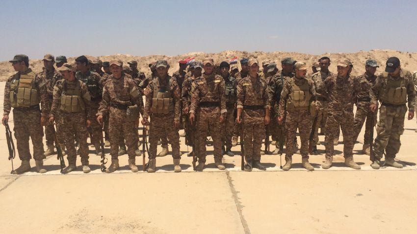 Sunni volunteers standing in their squads at a graduation ceremony at Al-Taqaddum Air Base, Habbaniya, Iraq.