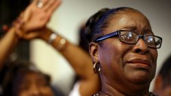 Rev. Jeannie Smalls cries during a prayer vigil held at Morris Brown AME Church for the victims of Wednesday's shooting at Emanuel AME Church on Thursday, June 18, 2015 in Charleston, S.C.  Dylann Storm Roof, 21, was arrested Thursday in the slayings of several people, including the pastor at a prayer meeting inside the historic black church.(Grace Beahm/The Post And Courier via AP, Pool)
