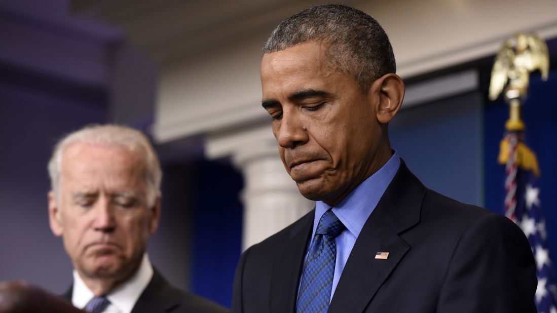 President Barack Obama, accompanied by Vice President Joe Biden, pauses while speaking in the Brady Press Briefing Room of the White House in Washington, June 18, on the church shooting in Charleston. 