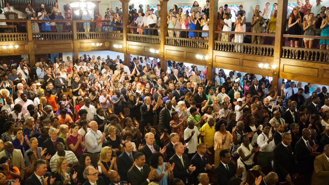 Parishioners applaud during a  memorial service on Thursday, June 18, at Morris Brown AME Church in Charleston, South Carolina. 
