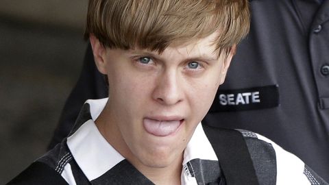 Dylann Roof, the 21-year-old charged with murdering nine people in a church shooting on Wednesday, June 17, is escorted by police in Shelby, North Carolina, on Thursday, June 18.
