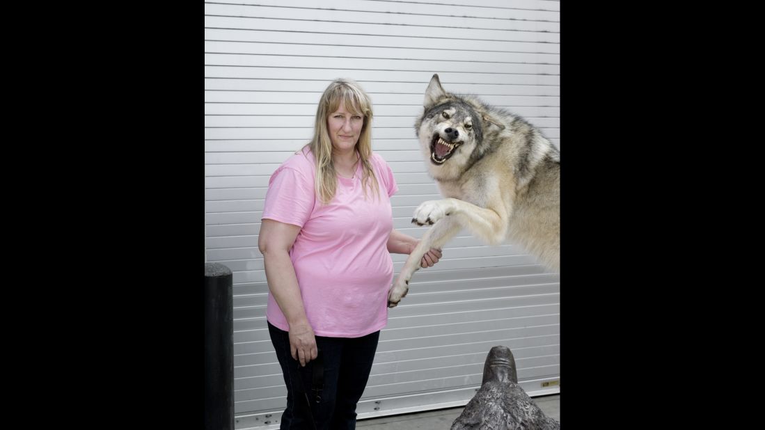 Carolin Brak-Dolny, from Frankford, Ontario, poses with a wolf.