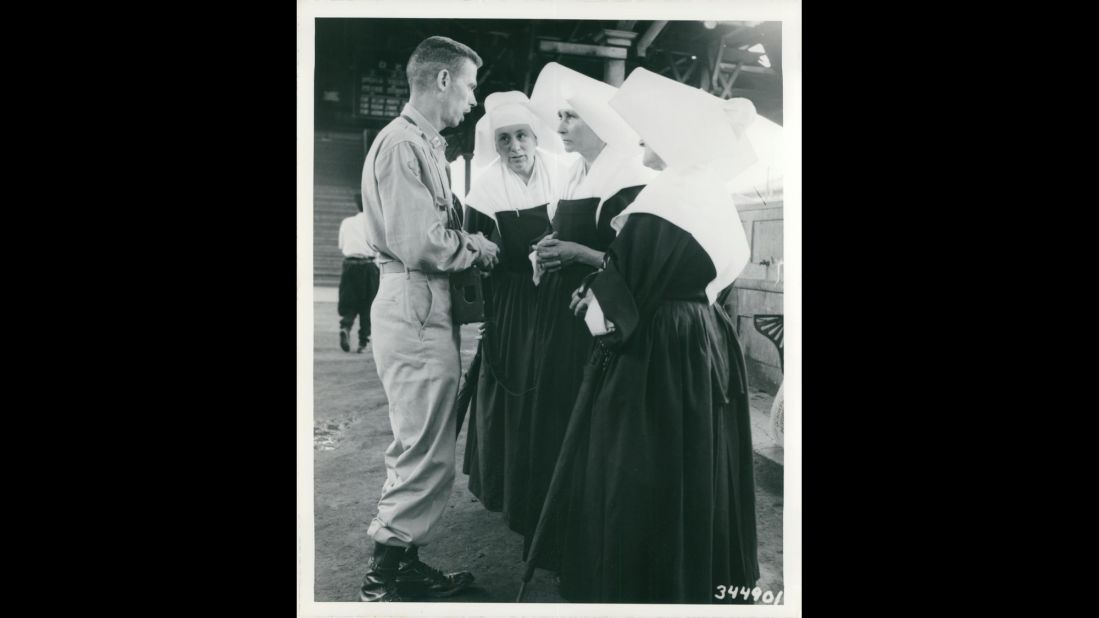 An unidentified U.S. Army captain speaks with three nuns at a railroad station somewhere in Korea in July 1950. Photo ID: SC 344901 