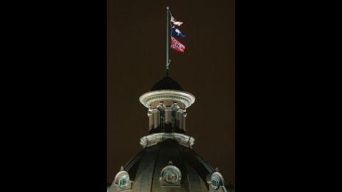 The Confederate flag flies on the dome of the Statehouse in Columbia, SC, before it is moved.