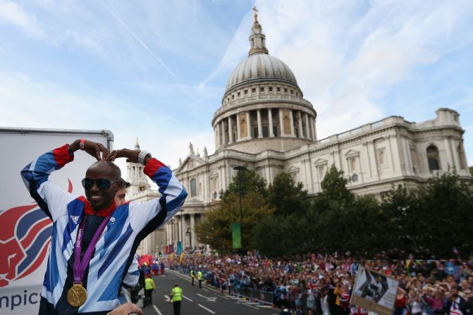 Farah recreates his "Mobot" celebration during the London 2012 Victory Parade on September 10, 2012 in front of St Paul's Cathedral. 