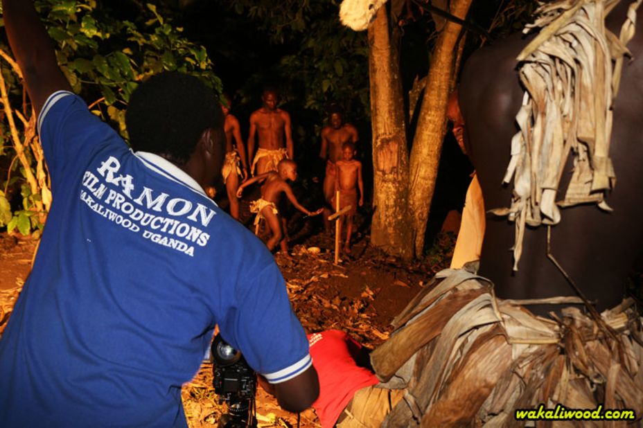 Self-taught director Isaac Nabwaana directing children and adults in a cannibal movie. Nabwaana started Ramon Film Productions in 2005 and has since made over 40 low-budget action movies.