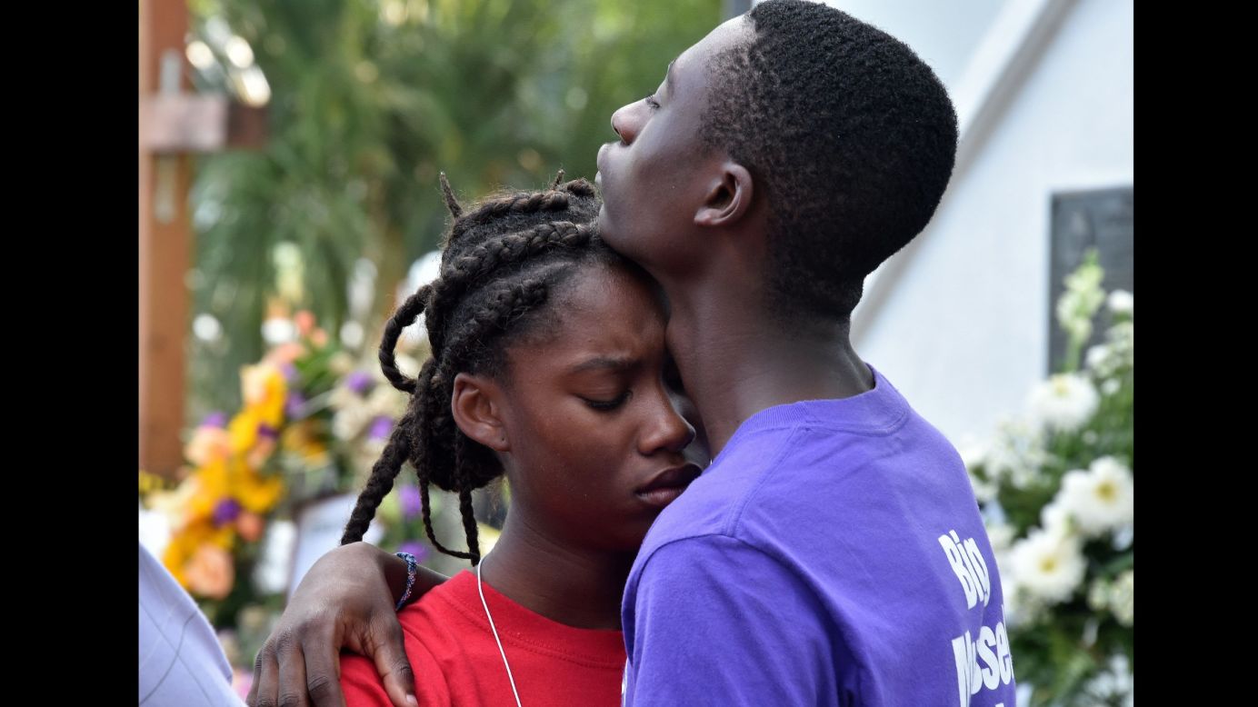 Young people grieve outside Emanuel African Methodist Episcopal Church in Charleston, South Carolina, on June 19. 