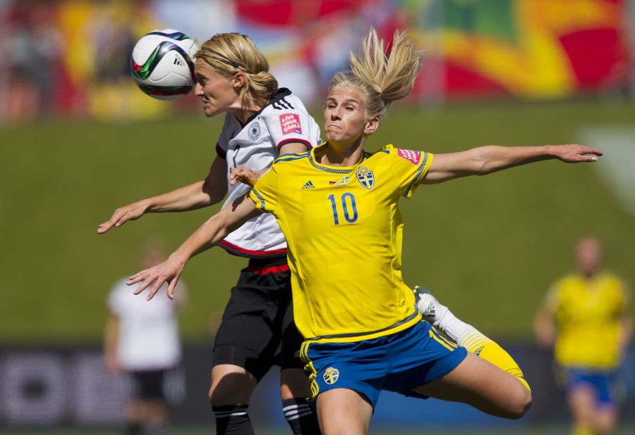 Germany's Saskia Bartusiak, left, collides with Sweden's Sofia Jakobsson during a round-of-16 match in Ottawa on June 20. Germany won 4-1 to advance to the quarterfinals. 