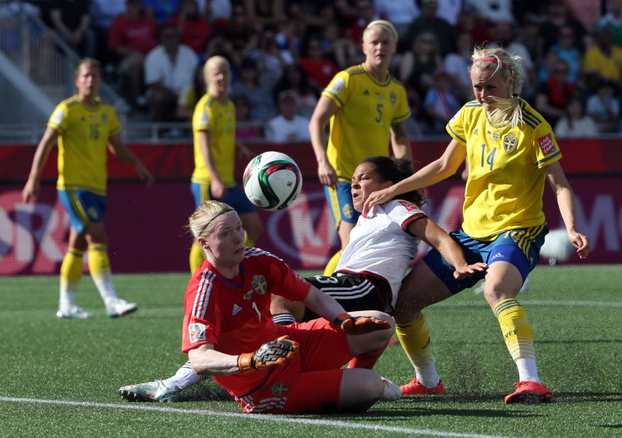 German forward Celia Sasic collides into Swedish goalkeeper Hedvig Lindahl.
