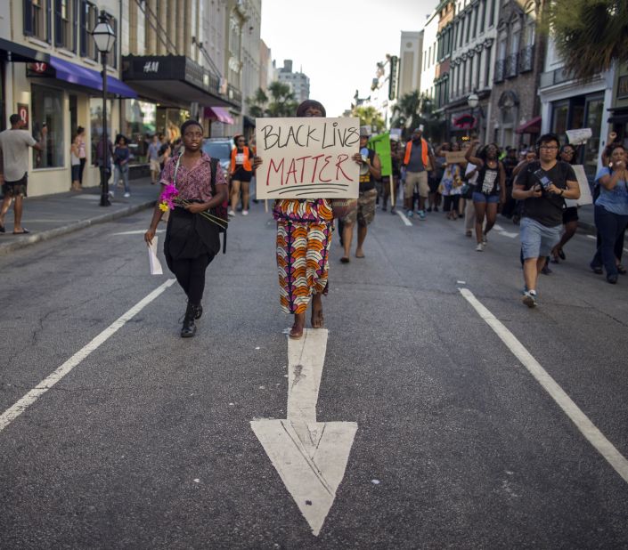 Louise Brown walks down King Street during a "Black Lives Matter" march on June 20 in Charleston, South Carolina. 