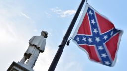 The Confederate flag is seen next to the monument of the victims of the Civil War in Columbia, South Carolina on June 20, 2015.