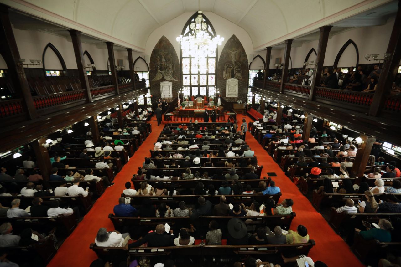 Parishioners fill the pews for the service. Church elders decided to hold the regularly scheduled Sunday school and worship service as they continue to grieve. 