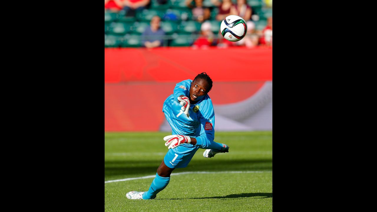 Cameroon goalkeeper Annette Ngo Ndom saves a shot on goal.